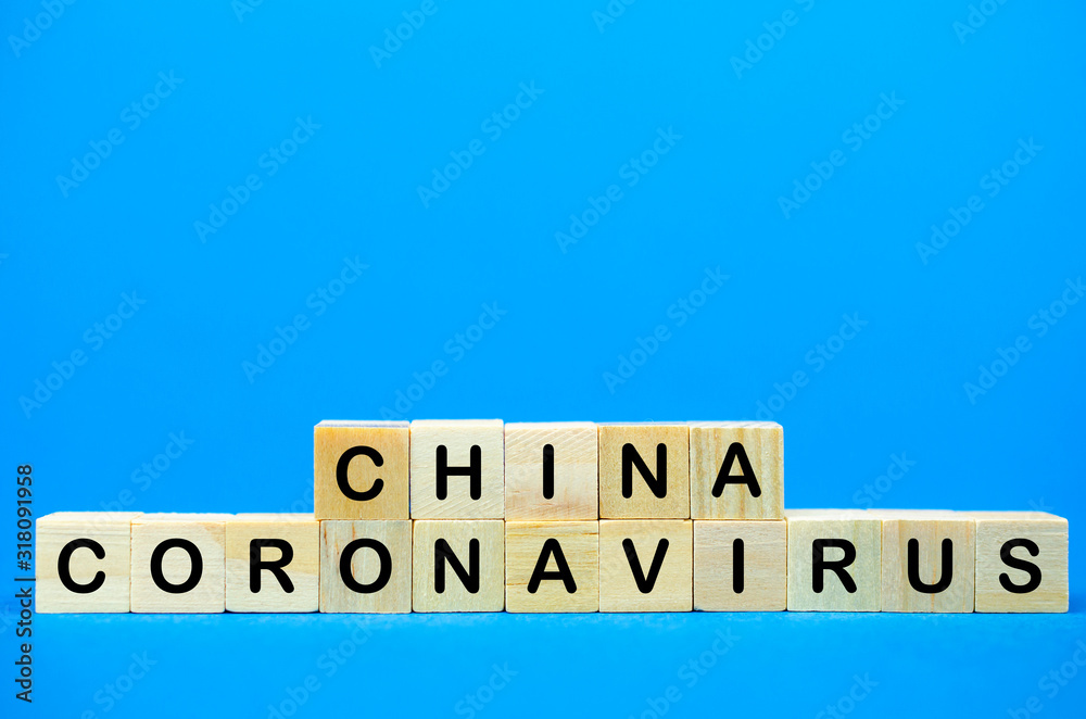 The inscription China Coronavirus on wooden cubes, blue background. Health concept, Chinese coronavirus The inscription China Coronavirus on wooden cubes, blue background. Health concept, Chinese coronavirus
