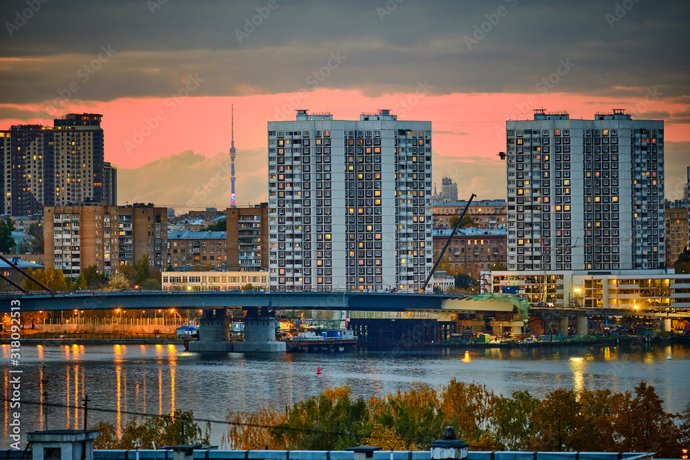 Naklejka premium Residential houses in the background of the TV tower in the evening in Moscow