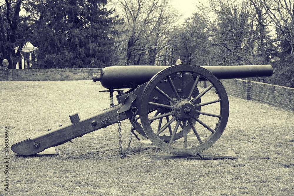 Black and white old photo vintage look of US civil war ear cannon in Fredericksburg Virginia. 