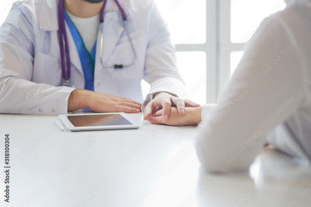 close up of patient and doctor prescribing medication close up of patient and doctor prescribing medication
