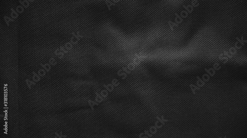 Stop motion animated black canvas pattern background. Surface with spotlight, dark tone.