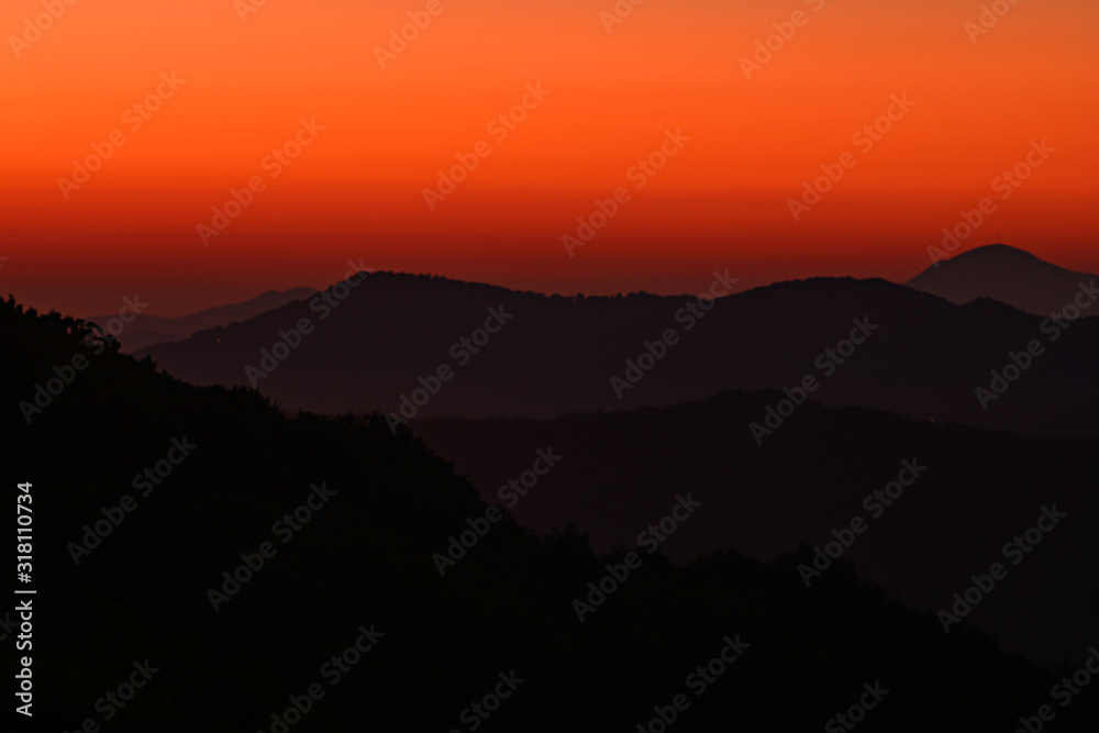 Fototapeta premium Orange Morning Sky Over Ridges