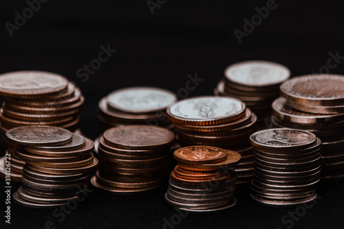 Wallpaper Mural Dark coin stacked on black background  Torontodigital.ca