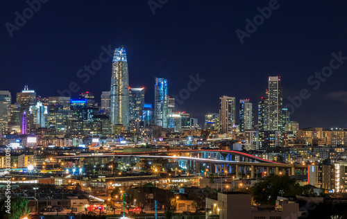 San Francisco skyline night view with city lights, the Bay Bridge and trail lights © SvetlanaSF