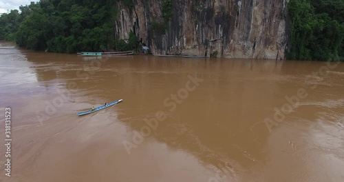 Driving Small Boat To Tham Ting Cave, Luang Prabang, Video In 4K photo