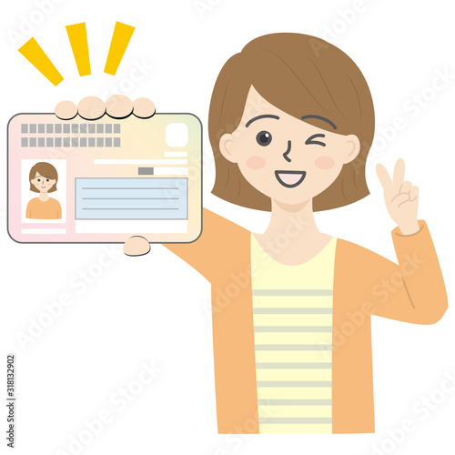 マイナンバーカードを持ってピースしてる若い女性