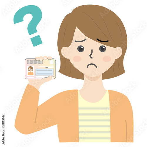 マイナンバーカードを持ってる若い女性（困る・悩む）
