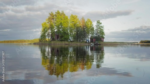 Small island on the lake with country house in Finland.