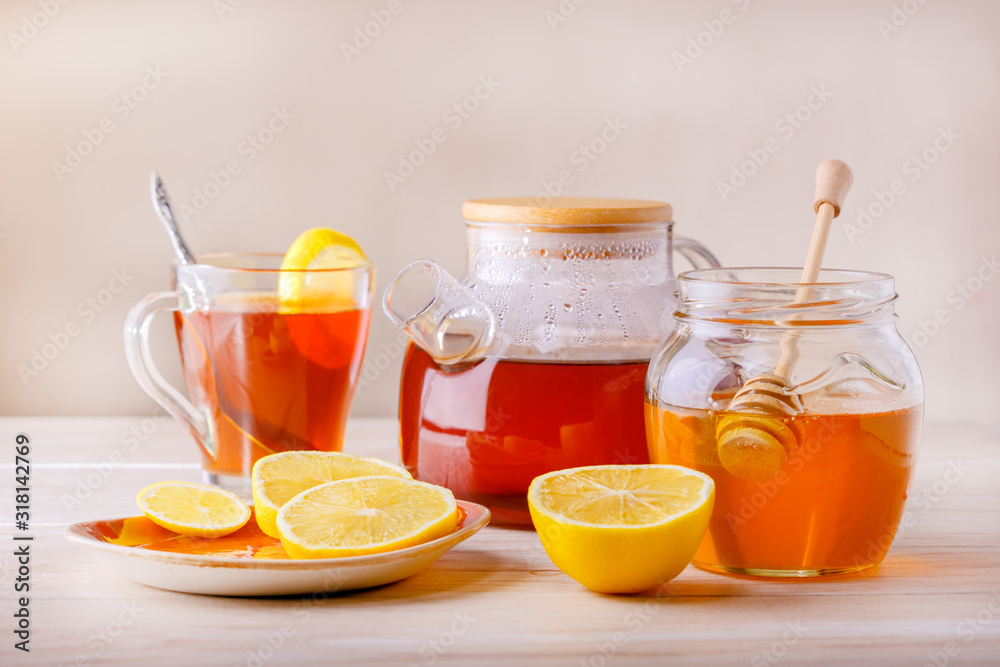 Fruit and herbal tea with lemon and honey on table. Delicious and healthy beverage. Fruit and herbal tea with lemon and honey on table. Delicious and healthy beverage.