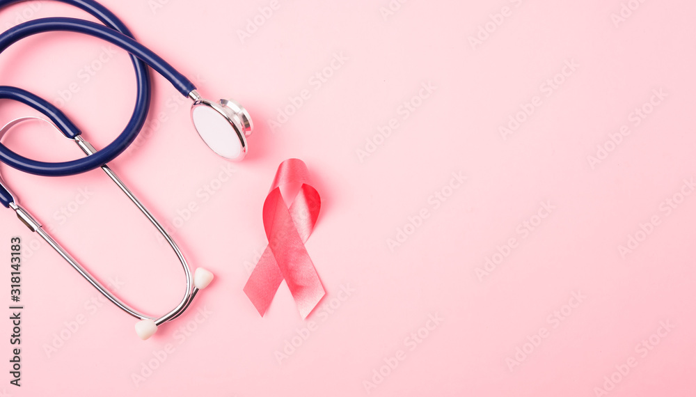 Breast Cancer Awareness Month Health concept, top view flat lay pink ribbon and stethoscope Breast Cancer Awareness Month Health concept, top view flat lay pink ribbon and stethoscope