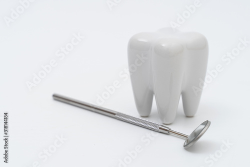 Teeth model and dentist tool on white © onairjiw