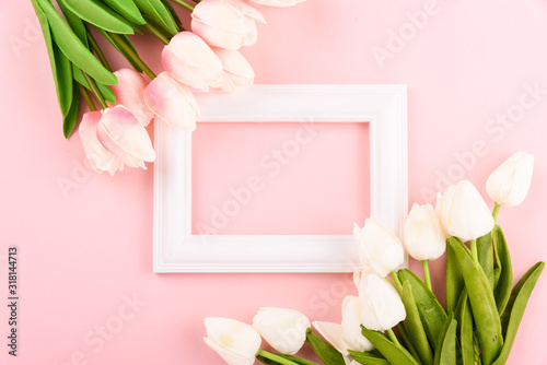 Fototapeta Naklejka Na Ścianę i Meble -  Happy Women's Day, Mother's Day concept. top view flat lay Tulip flower and photo frame