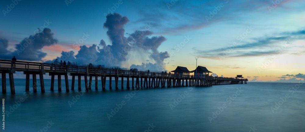 Fototapeta premium Old Pier Seashore Under Stormy Dusk Sky