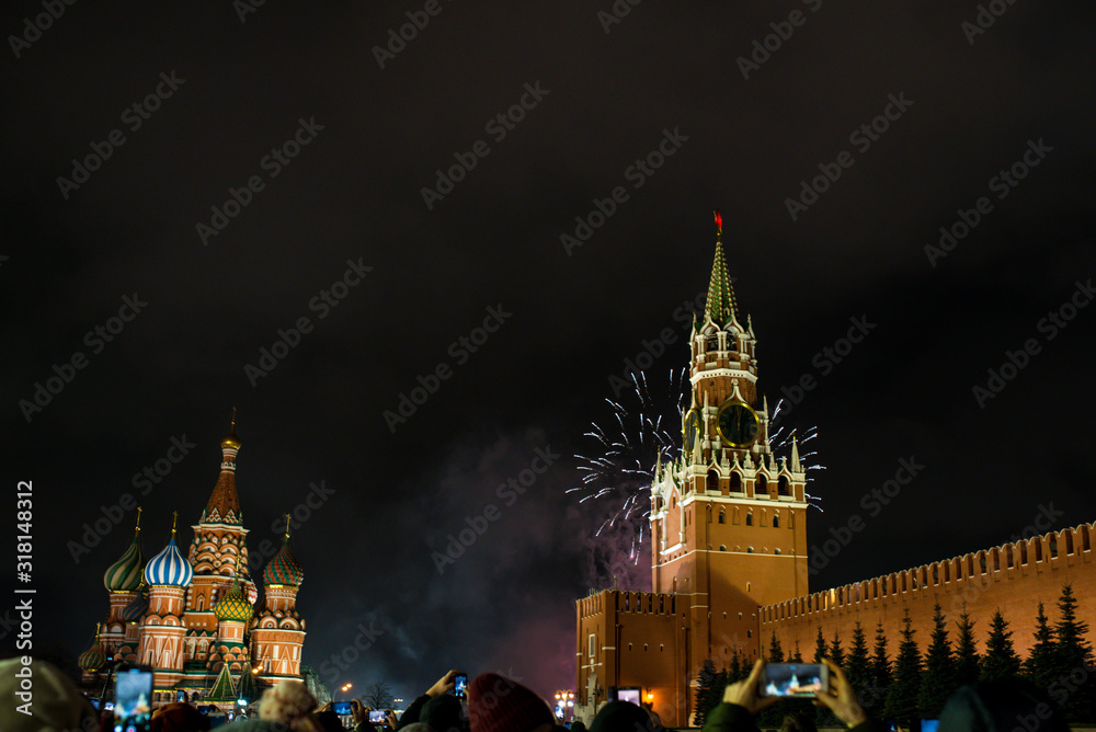Fototapeta premium salute in honor of the new year 2020 on red square against the Kremlin, Spasskaya tower and St. Basil's Cathedral