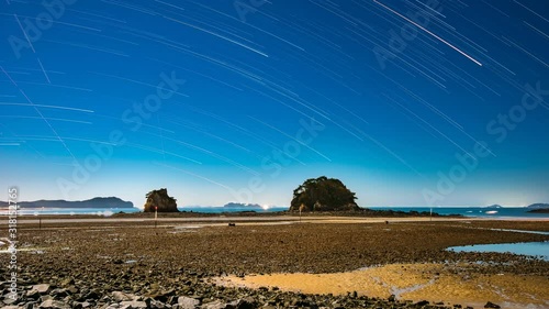 Time Lapse of High Tide and Star Trails by the Beach