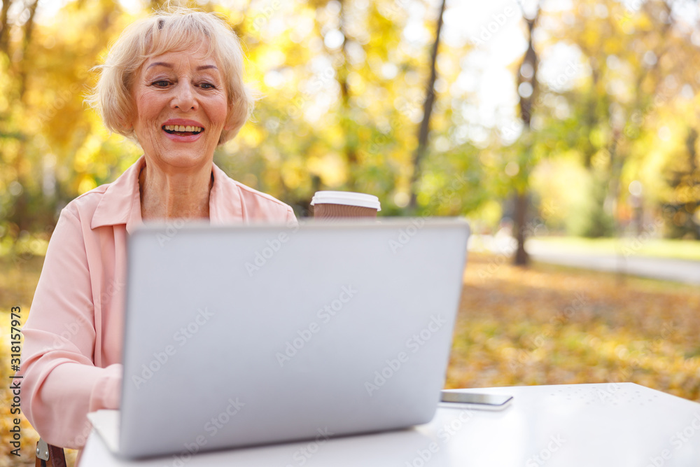 Cheerful lady making a video call to her friend Cheerful lady making a video call to her friend