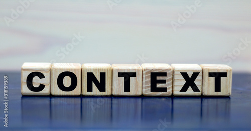 concept words context on cubes on a wooden background
