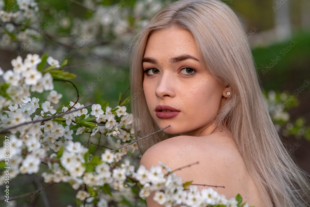 beautiful blonde girl in spring cherry garden beautiful blonde girl in spring cherry garden