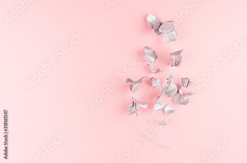 Cute girlish new year background - elegant silver bouquet on pastel pink paper, top view, copy space. © finepoints