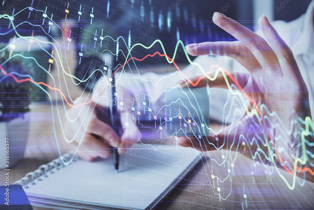 Forex chart displayed on woman's hand taking notes background. Concept of research. Multi exposure Forex chart displayed on woman's hand taking notes background. Concept of research. Multi exposure