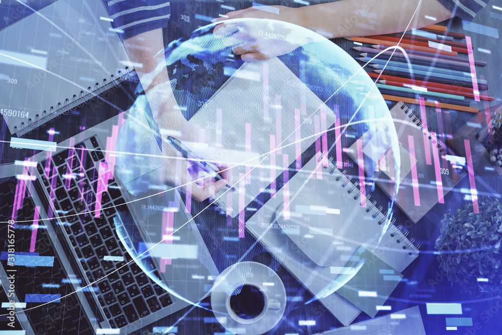Financial chart drawn over hands taking notes background. Concept of research. Double exposure Financial chart drawn over hands taking notes background. Concept of research. Double exposure