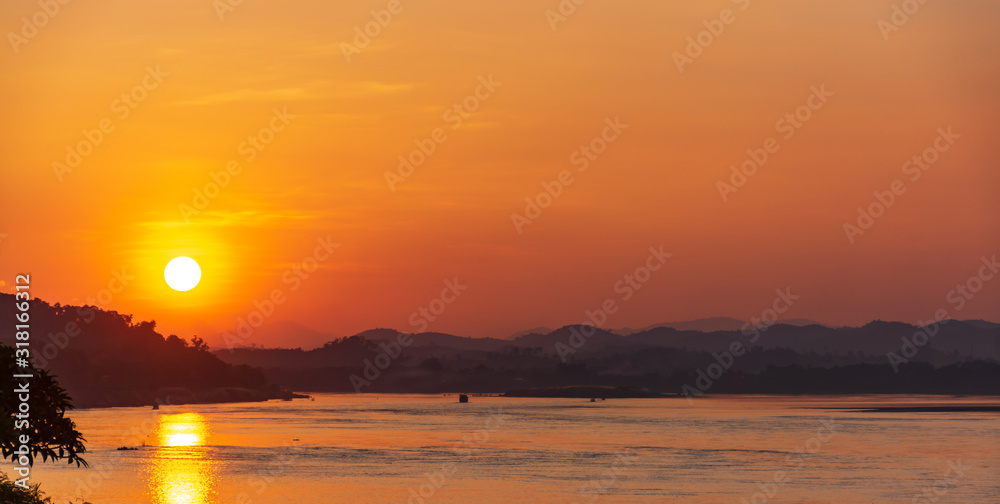 Scenic View Of Landscape Against Sky During Sunset