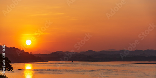 Scenic View Of Landscape Against Sky During Sunset