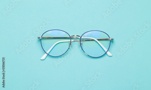 Eye glasses isolated on blue background.