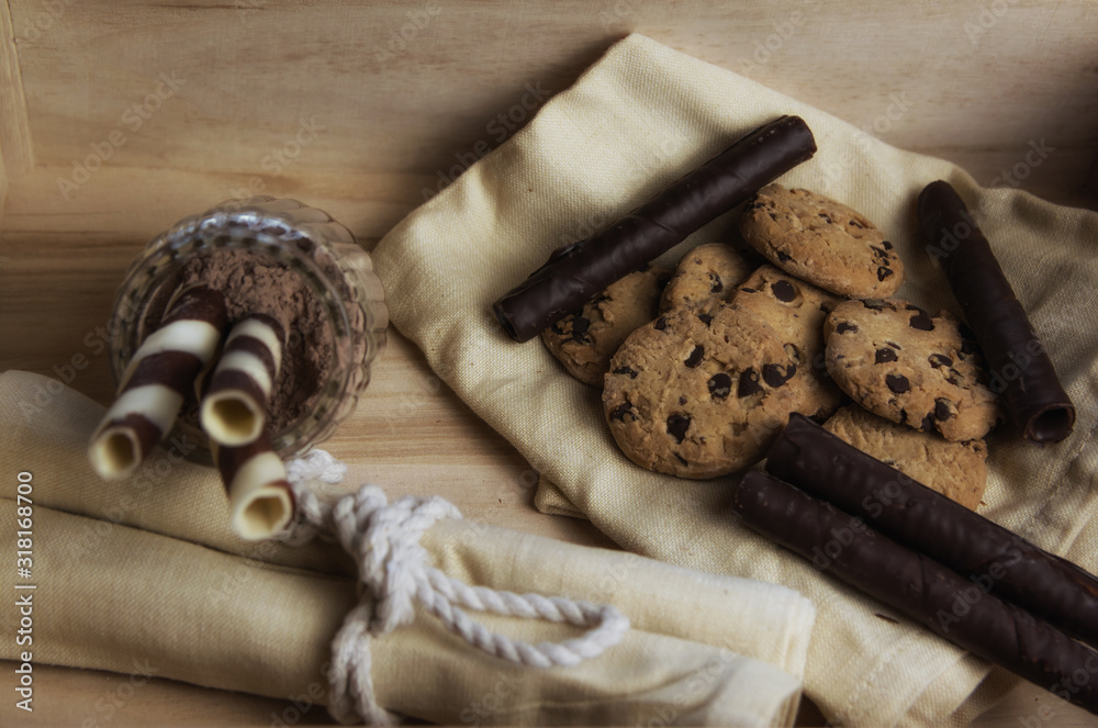 Chocolate waffles in a basket with cookies with and chocolate sprinkles. Close up and depth of field Chocolate waffles in a basket with cookies with and chocolate sprinkles. Close up and depth of field