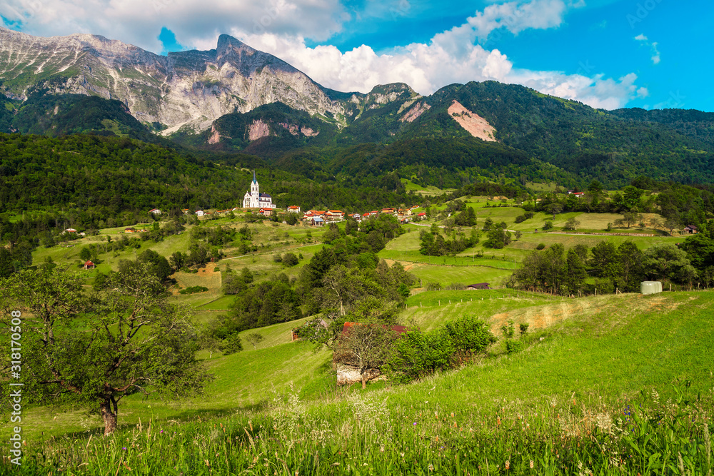 Beautiful summer alpine landscape and Dreznica village with mountains, Slovenia