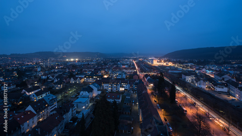 cityscape at night time from loerrach in southern germany. photo