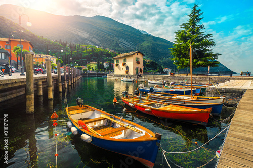 Fototapeta Naklejka Na Ścianę i Meble -  Colorful fishing boats on the lake, Garda lake, Torbole, Italy