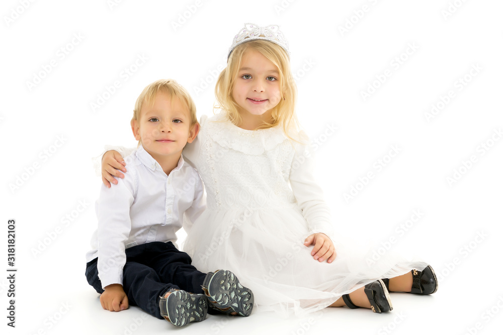 Fotografie Brother and sister, boy and girl posing in the studio. Friendshi