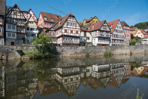 Schwäbisch Hall, Germany - July 25, 2019; City view with half timbered houses on the waterfront of a touristic town on the romantic road in Bavaria