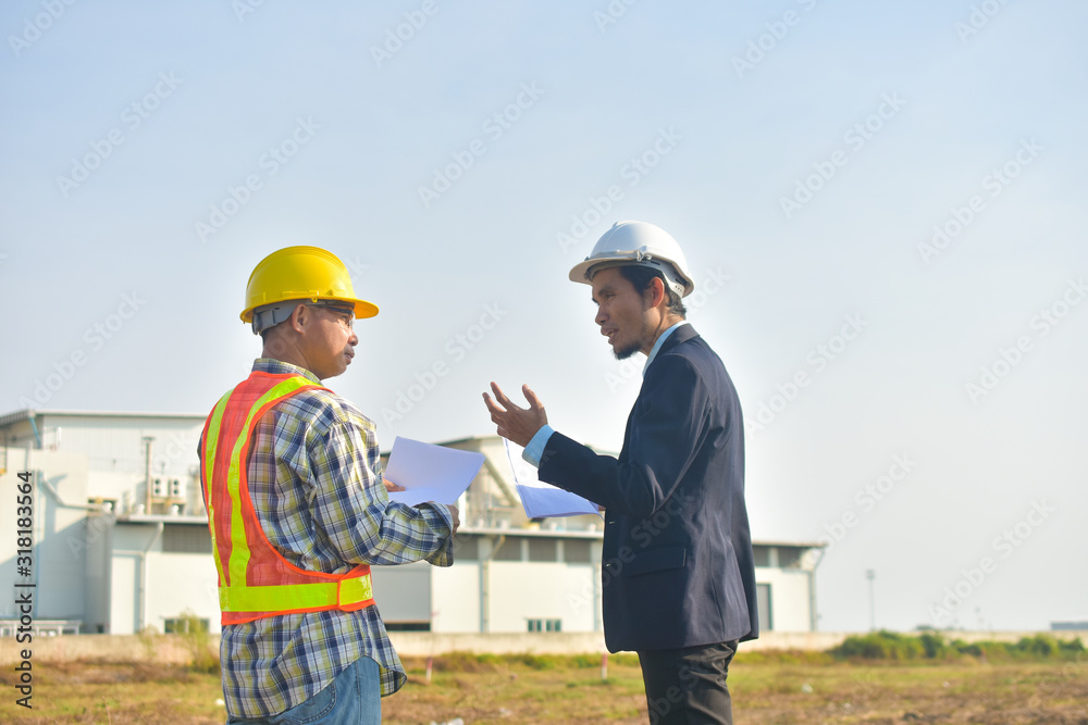 Project Manager taking with Engineer construction plan project building factory construction Project Manager taking with Engineer construction plan project building factory construction