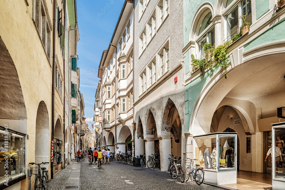 The famous road Via dei Portici with arcades on both sides in Bolzano, South Tyrol, Italy