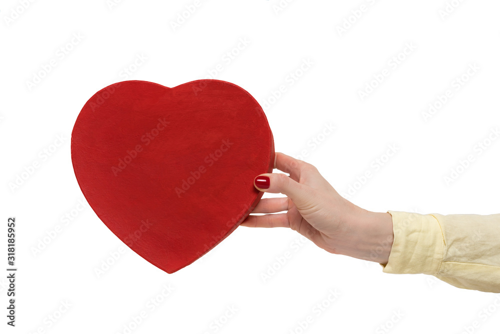 Obraz premium Vintage style red heart shaped box on female hand isolated on white background. Front view