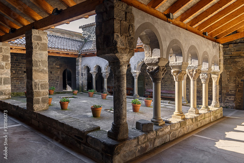 LES MASIES DE RODA, SPAIN- January 18,2020: Interior view of the Cloister of the 11th Century Romanesque-style  Benedictine Monastery of Sant Pere de Casserres, restored in 1998. photo