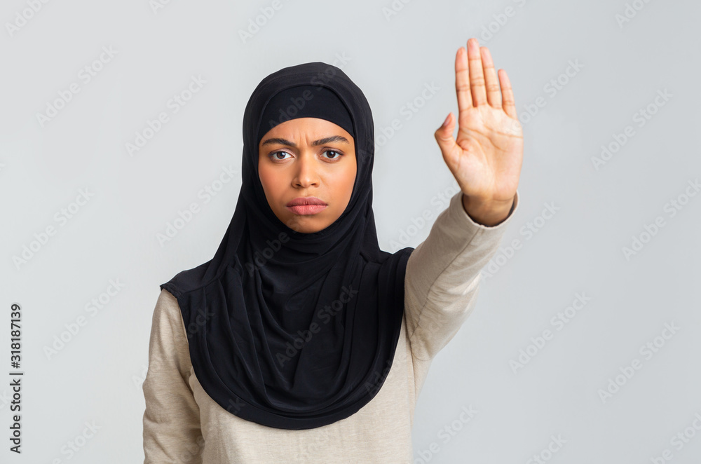 Serious Black Muslim Woman In Headscarf Showing No With Her Hand Serious Black Muslim Woman In Headscarf Showing No With Her Hand