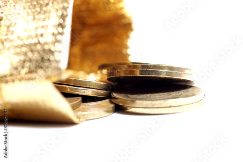 Close up shot of stacked golden coin isolated