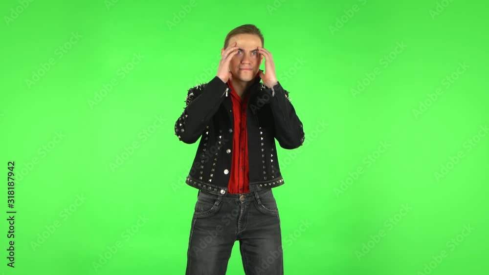 Guy looks in surprise at camera and is shocked by what she saw. Green screen Guy looks in surprise at camera and is shocked by what she saw. Green screen