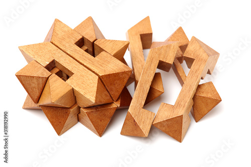 wooden puzzle over white background