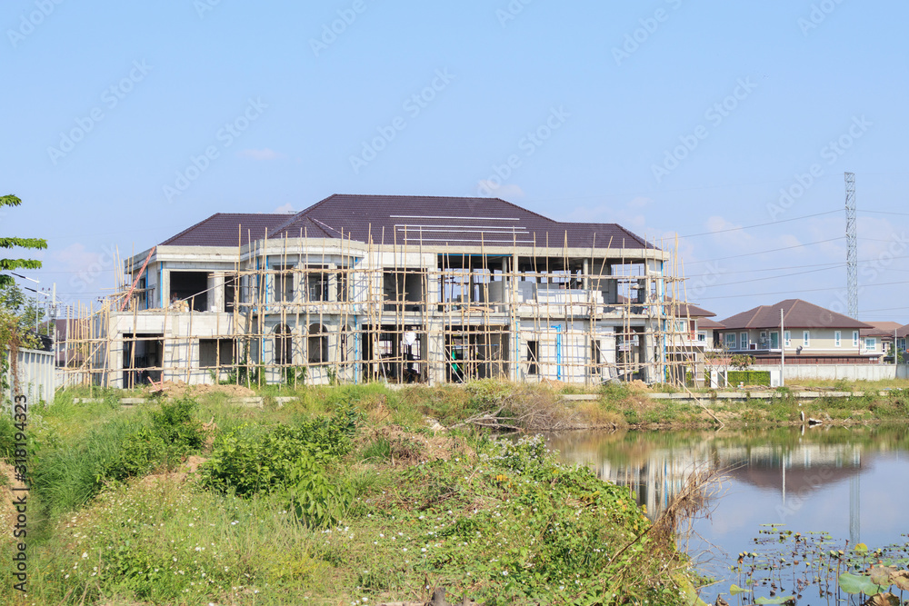 New residential house contemporary style building in progress at construction site New residential house contemporary style building in progress at construction site