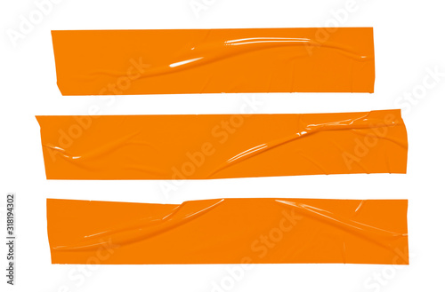 Sticker tape ripped torn pieces. Orange sticky plastic tapes set isolated on white background