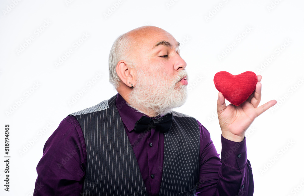 Health care. Senior bald head bearded man hold red heart. Heart problem and healthcare. Mature man with valentines heart. Preventing heart attack. Fall in love. Heartbeat diagnostics and treatment