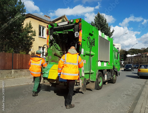 Collection and transportation of domestic garbage by municipal service employees. Control of the ecological situation in cities. Utilization of human waste. Limited speed. Territory cleaning photo