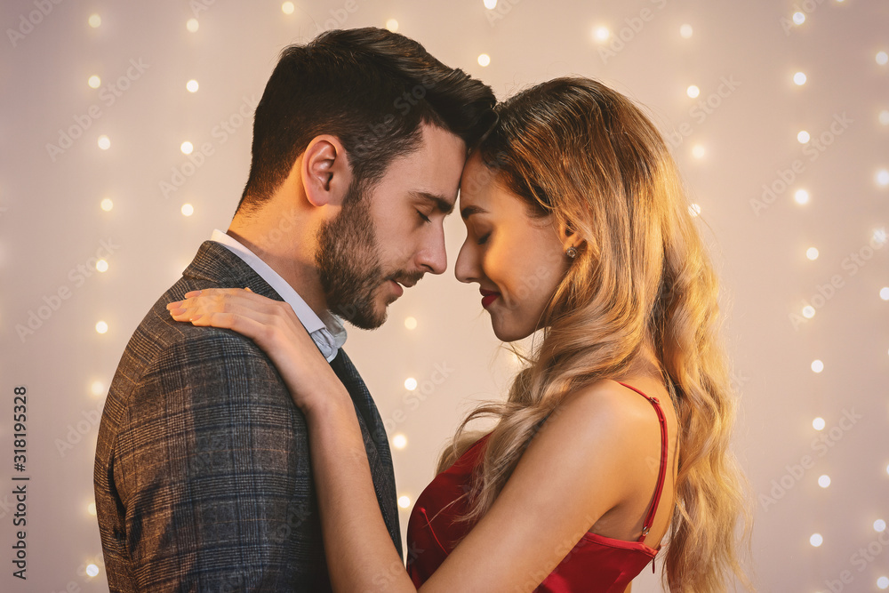 Romantic Portrait Of Tender Couple Cuddling With Closed Eyes, Touching Foreheads Romantic Portrait Of Tender Couple Cuddling With Closed Eyes, Touching Foreheads