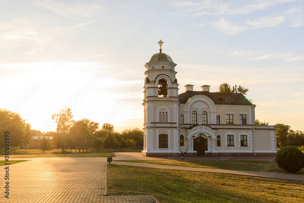 Saint Nicholas Garrison church in Brest fortress against the sunset in summer, Belarus