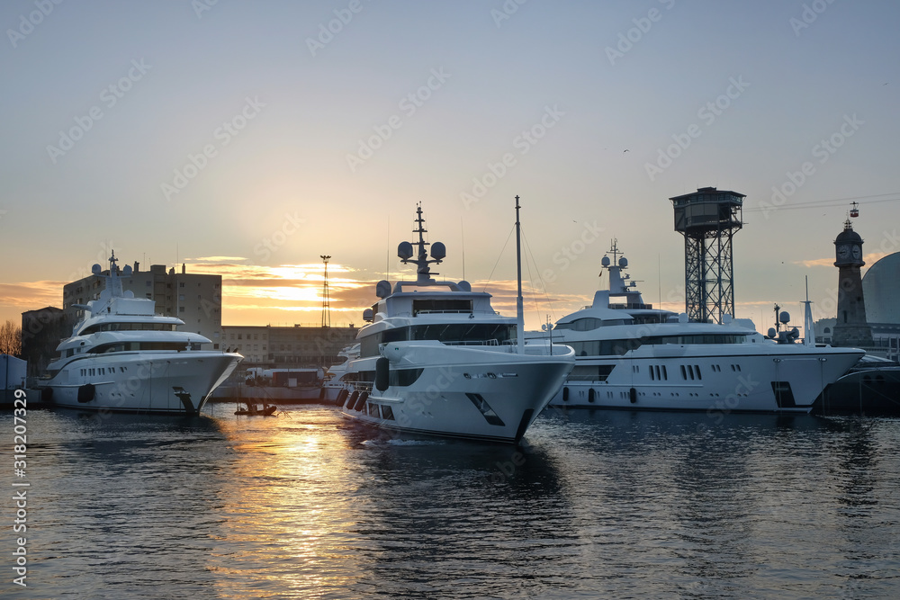 Luxury yachts moored in the port. Lifestyle, vacation concept.