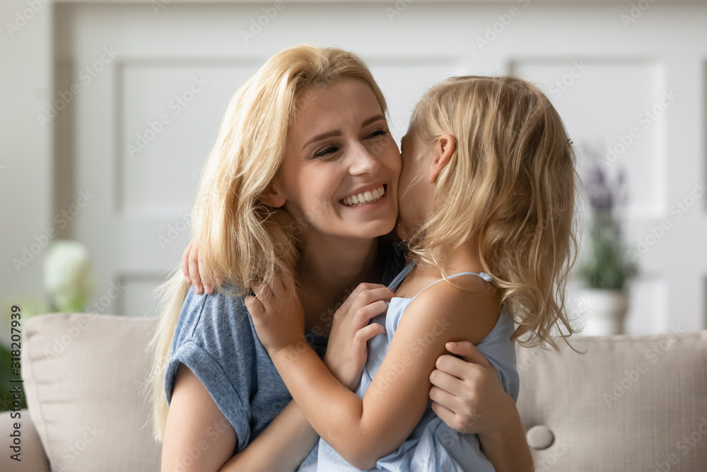 Joyful young mother playing with small daughter. Joyful young mother playing with small daughter.